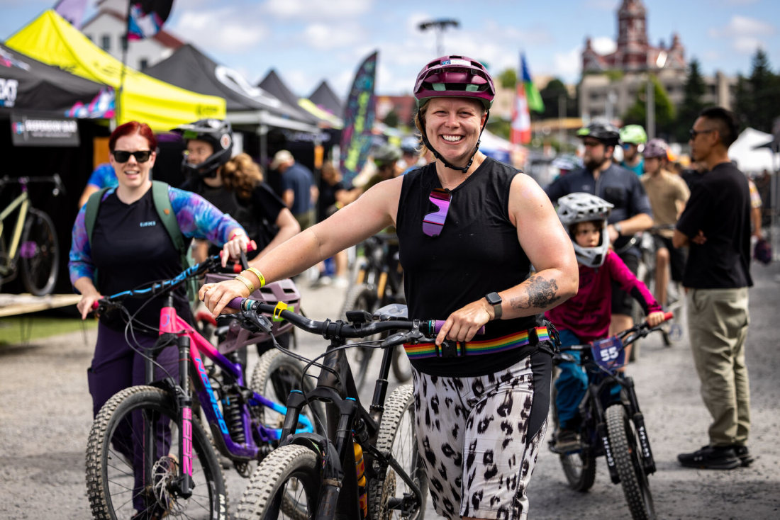 A person holds their phone up during a concert.